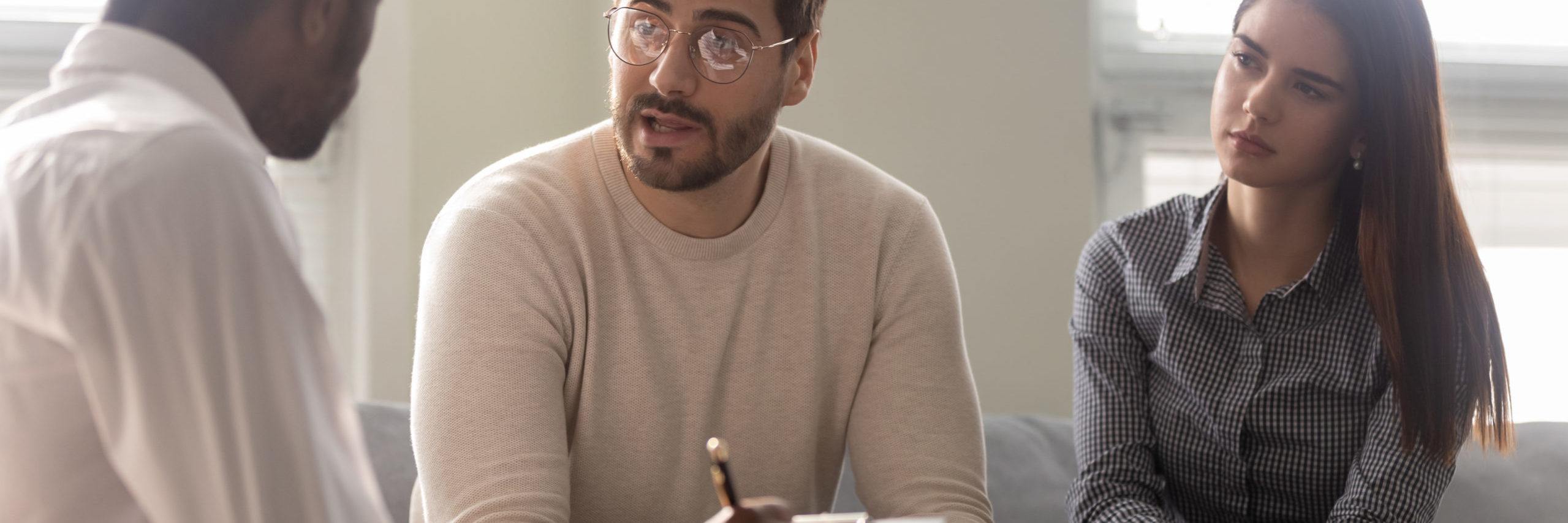 Disappointed,Couple,At,Reception,With,Family,Therapist.,African,American,Doctor